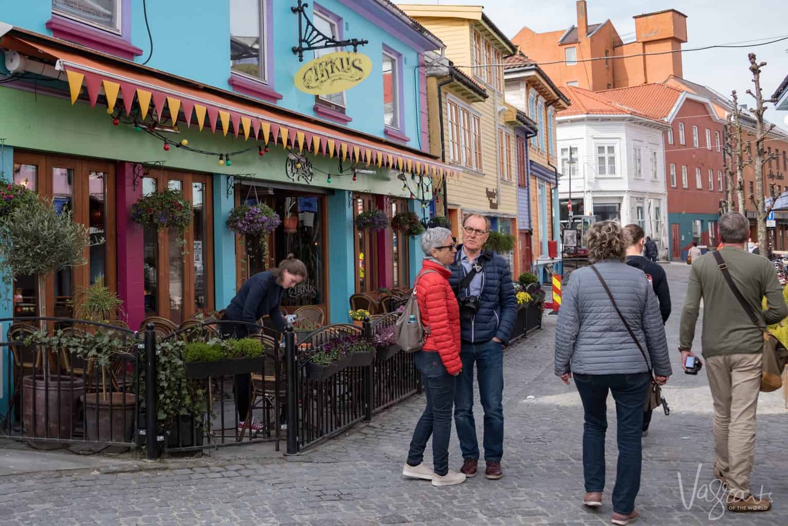 Tourists standing in an alleyway on a Viking River cruise excursion in Norway