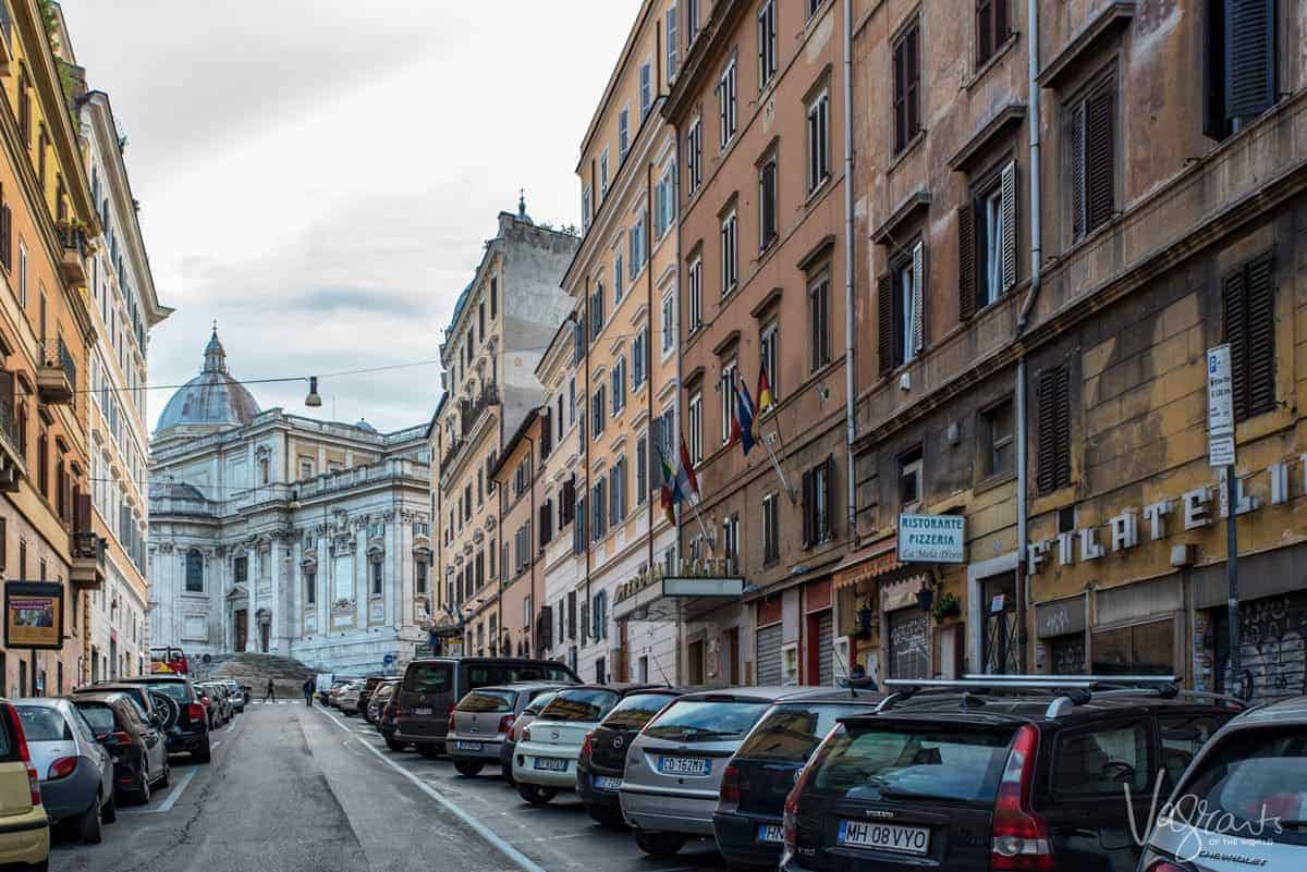 Cars parked along Rome's famous shopping street.