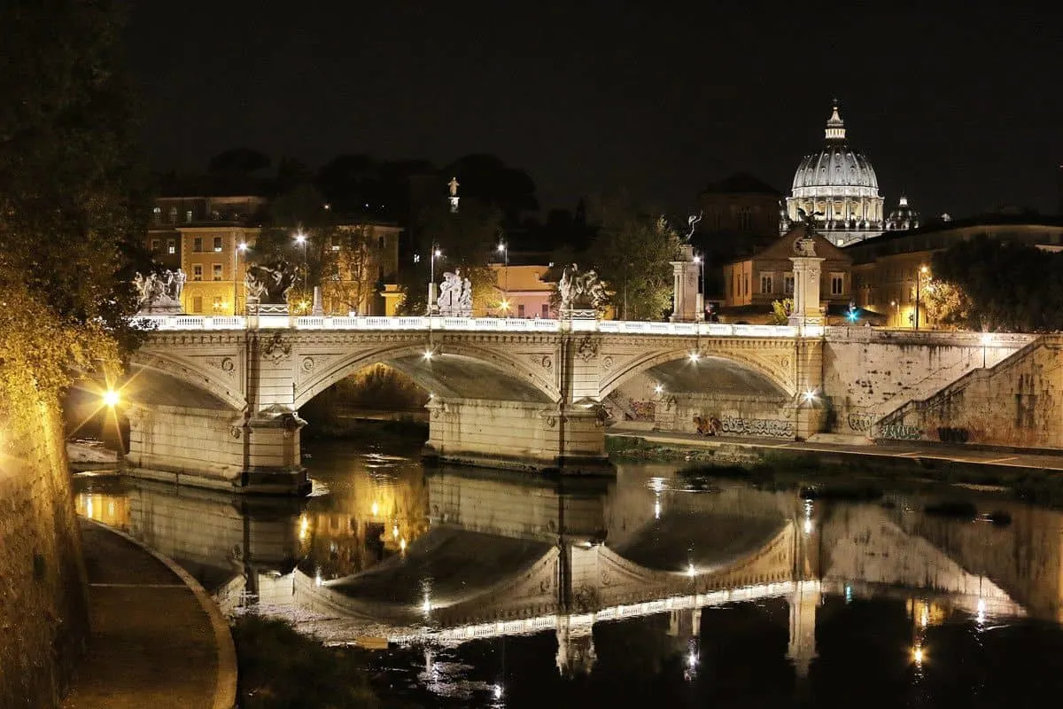 Bridge reflection at night in Trastevere neighbourhood, Rome.