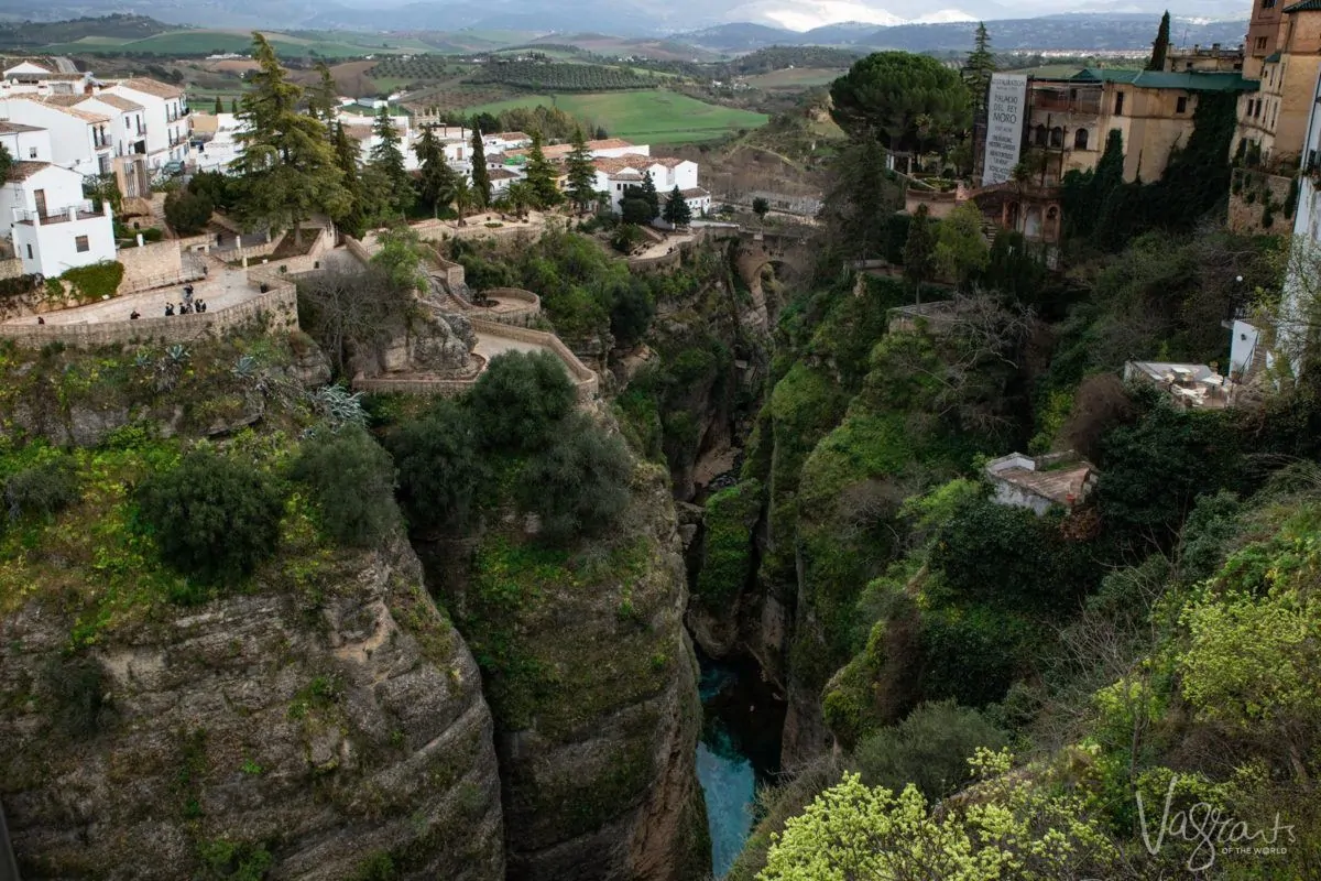 Deep rocky and green gorge of Ronda the largest white village in Spain
