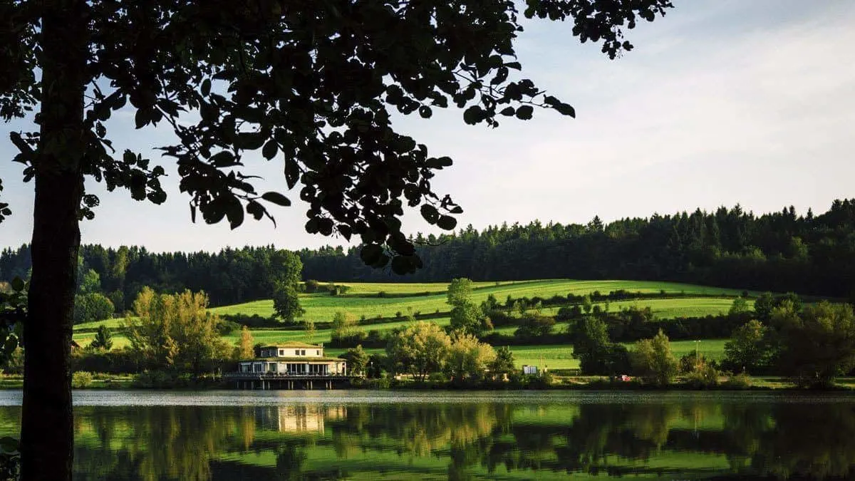 Homestead under green hills at Thousand Islands. 