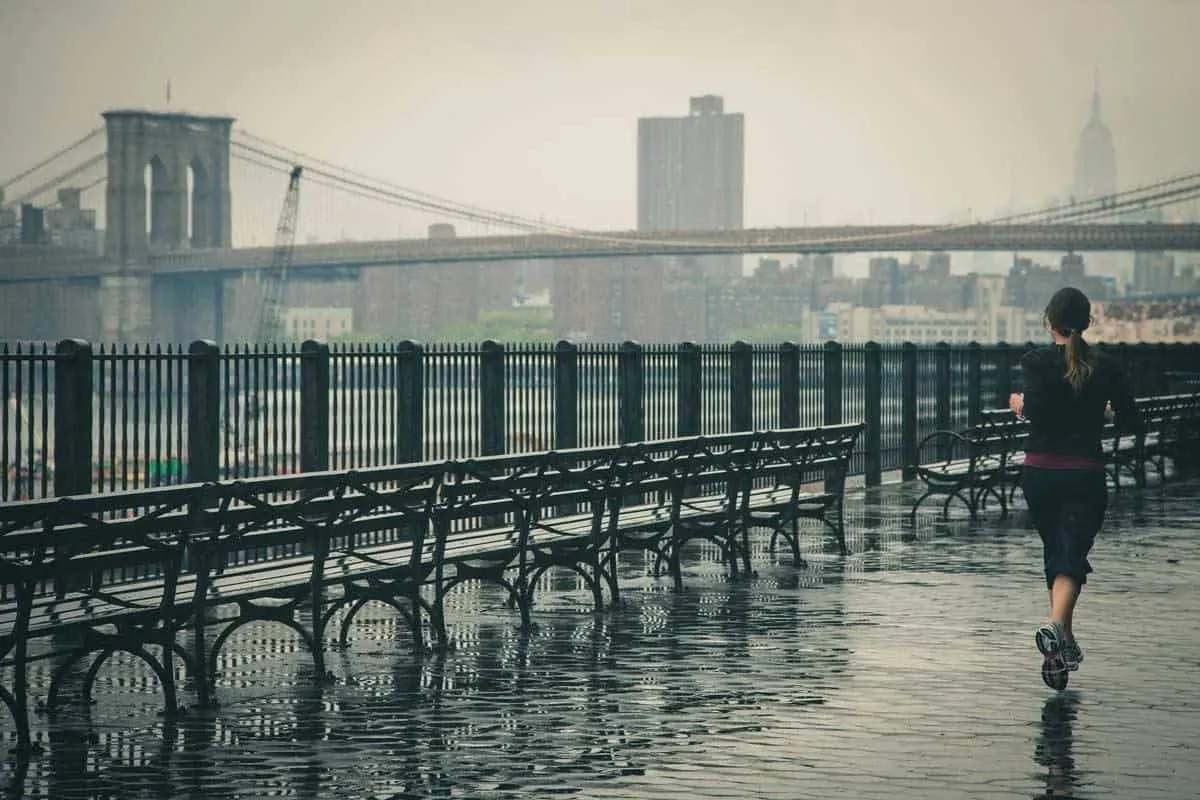 Travel Fitness - Lady jogging in a city