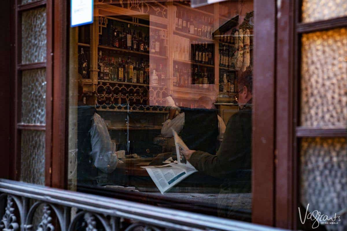 Customer reading the paper in El Rinconcillo bar in Seville Spain.. 