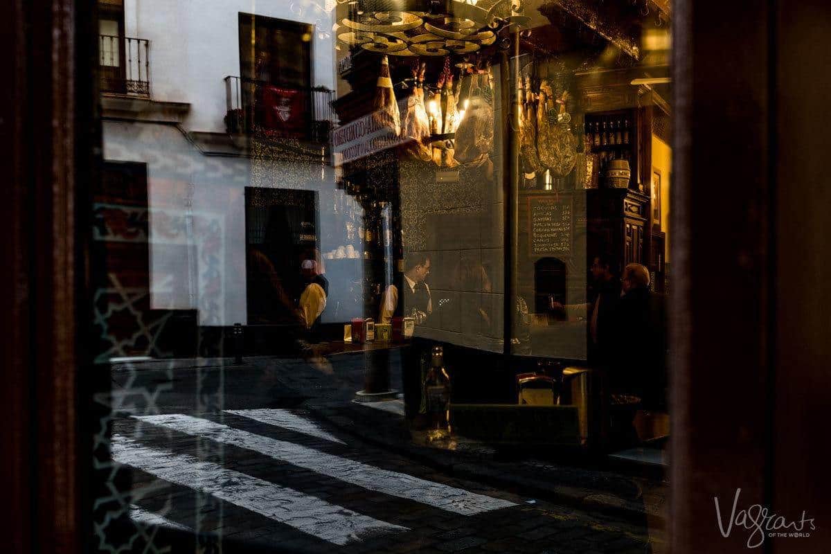 Sneaking look at the waiters through the window of El Rinconcillo - the oldest bar in Seville. 