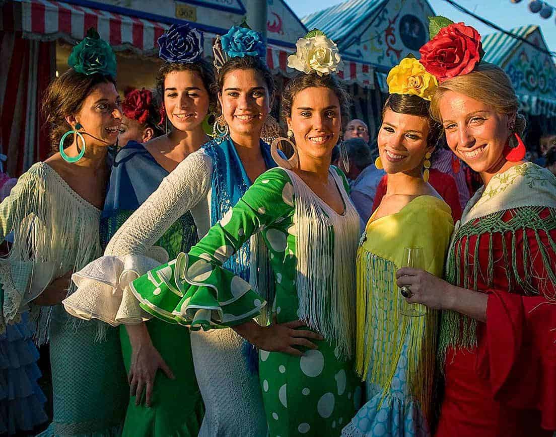 Six flamenco dancers in traje de flamenca the traditional flamenco dress.