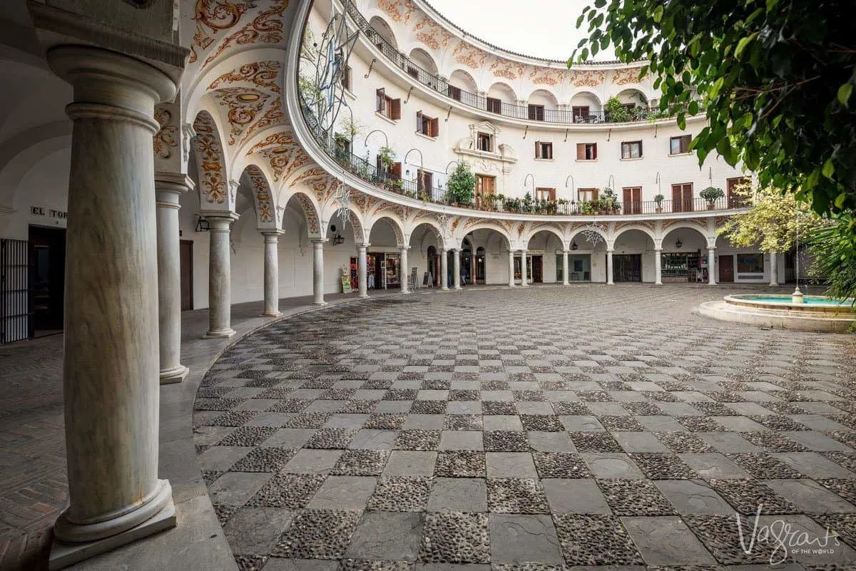 Seville's Round Plaza with chequered courtyard