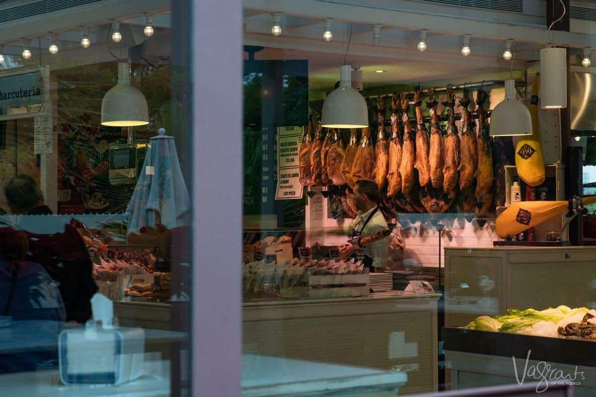 Hanging hams in the Market Lonja del Barranco.