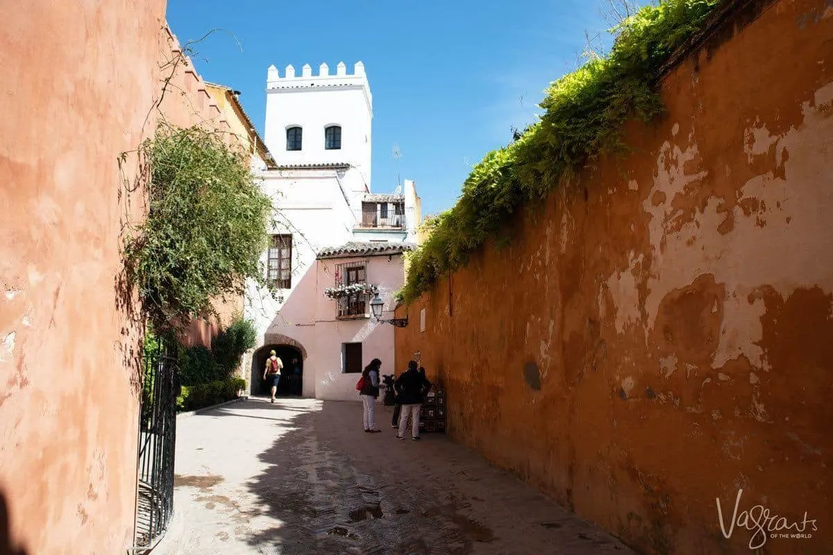 Mud walls and street vendor in Barrio Santa Cruz.