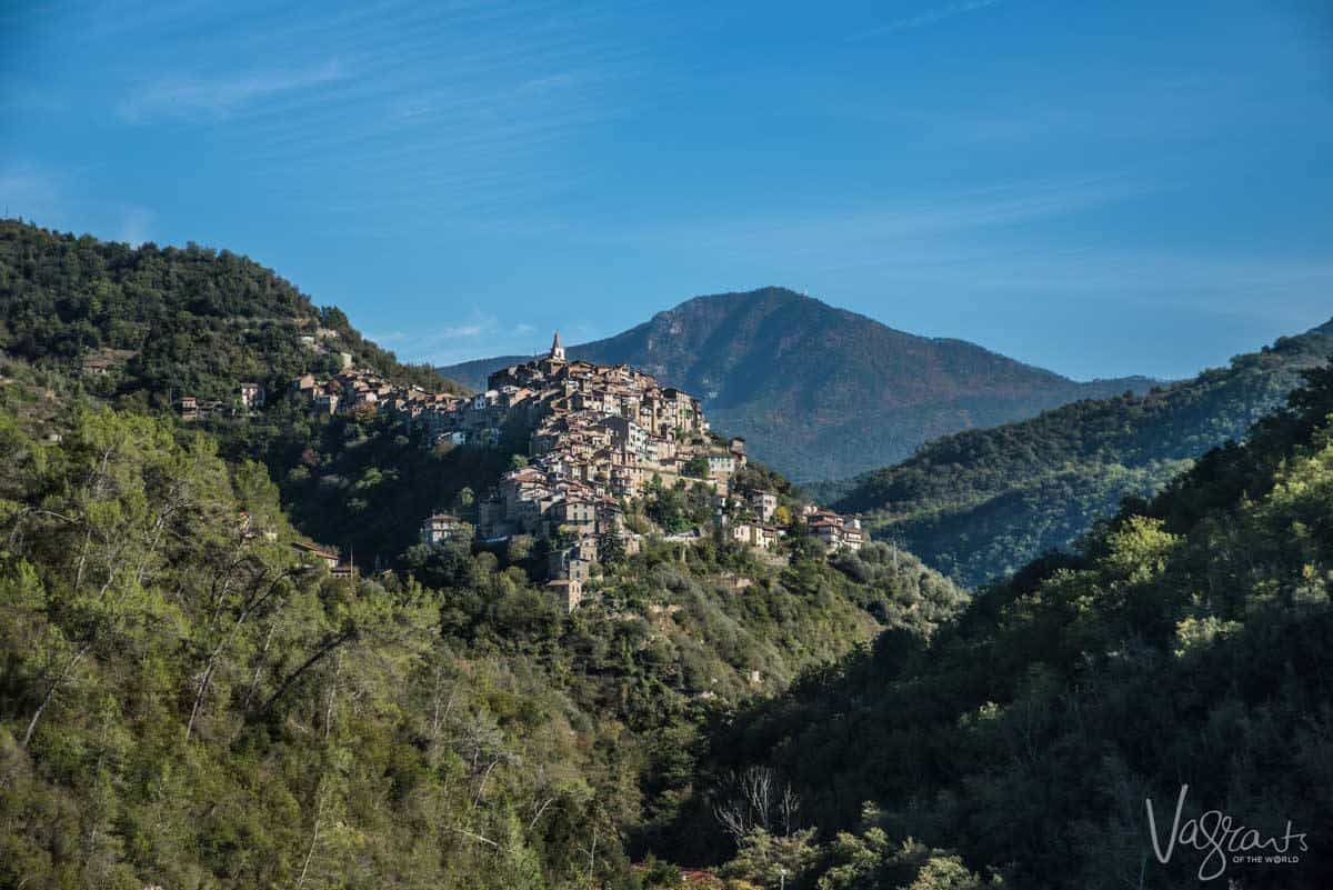 Walkers view across the valley to a village at Apricale Liguria Italy. 