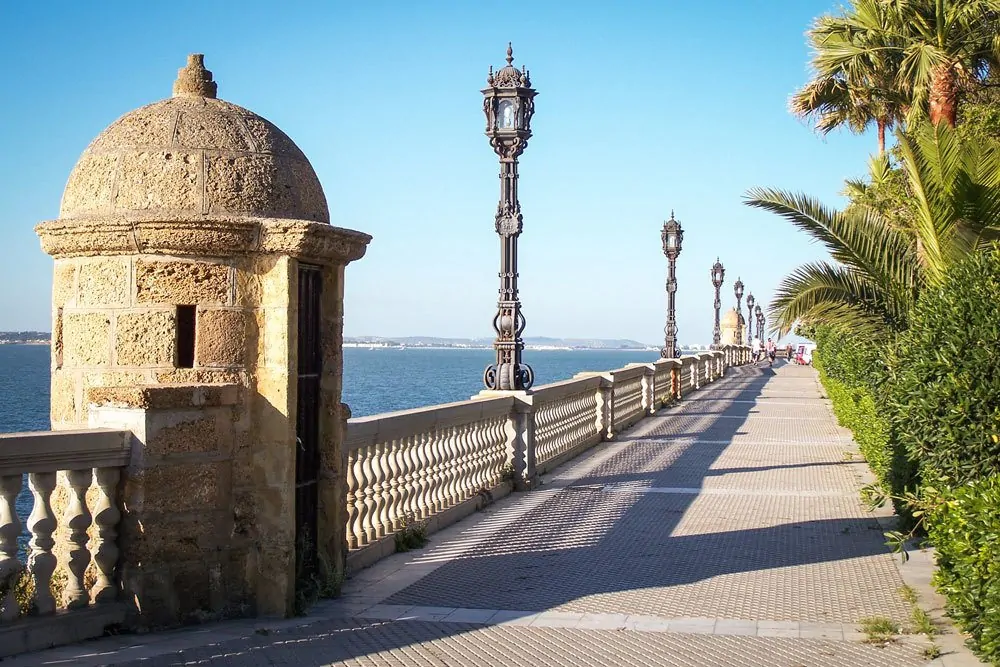 Stone guard house along promenade next to the water in Cadiz. A great free thing to do in Cadiz on your Day trip from Seville to Cadiz