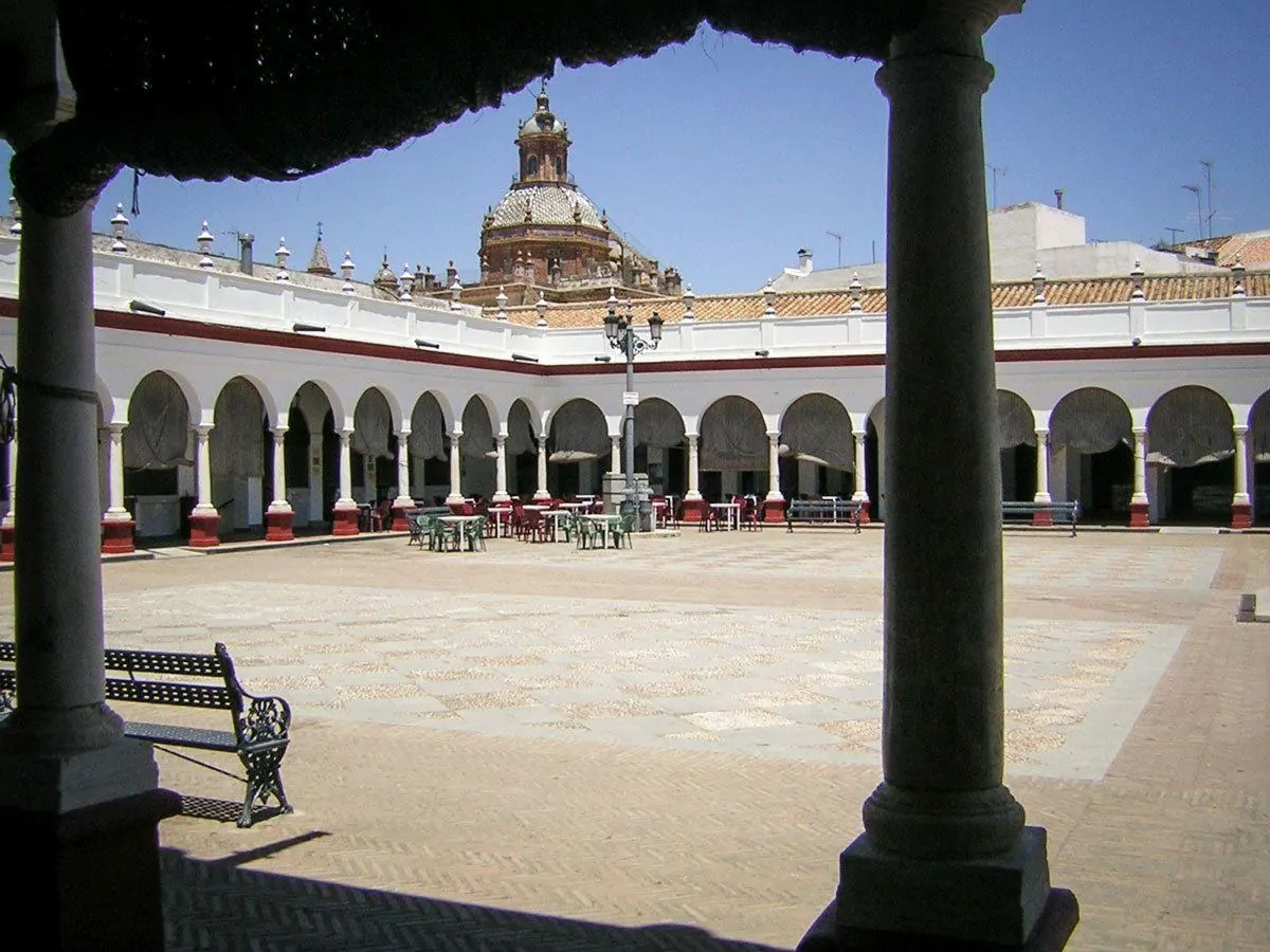 White arches surround this square in Carmona. Looking for things to do in Seville then try a Day trip from Seville to Carmona