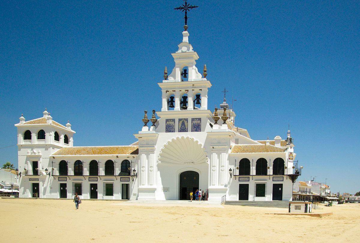 White Cathedral with large black ornate cross. An unusual thing to see on Day Trips from Seville Donana National Park