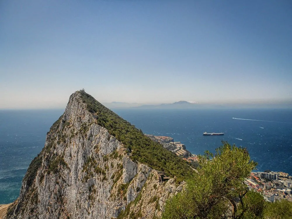 The rock of Gibraltar and ships on ocean. Visit another country on your Day trips from Seville, do Seville to Gibraltar