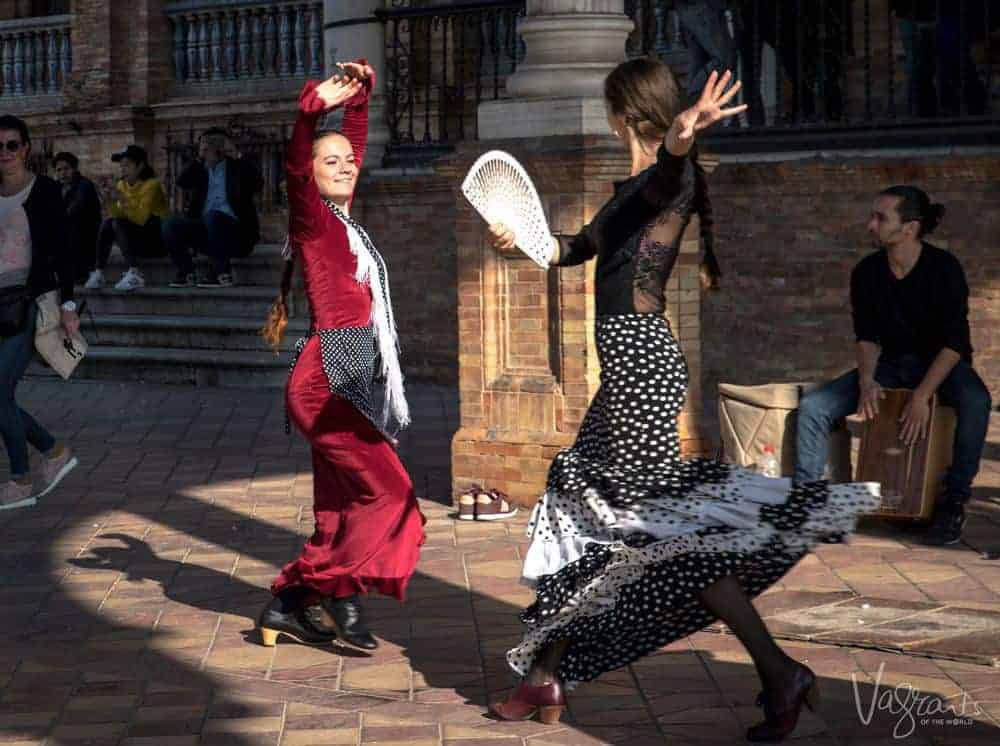 Two colourful flamingo dancers in Seville as part of our Best Day trips from Seville