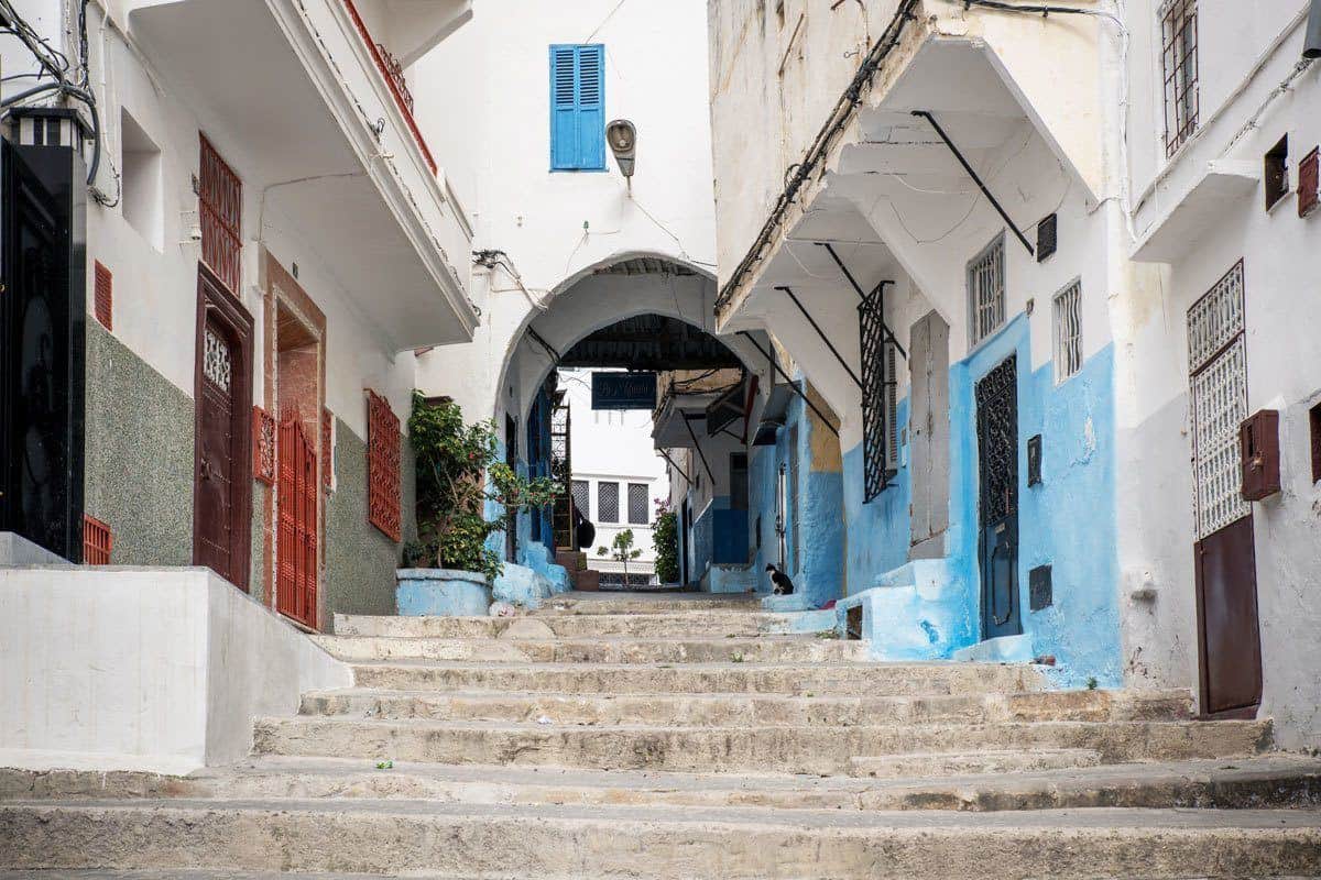 Steps out of medina with white walled houses in Tangier. You probably never thought of adding a Day trip from Seville to Tangier in your Seville itinerary.