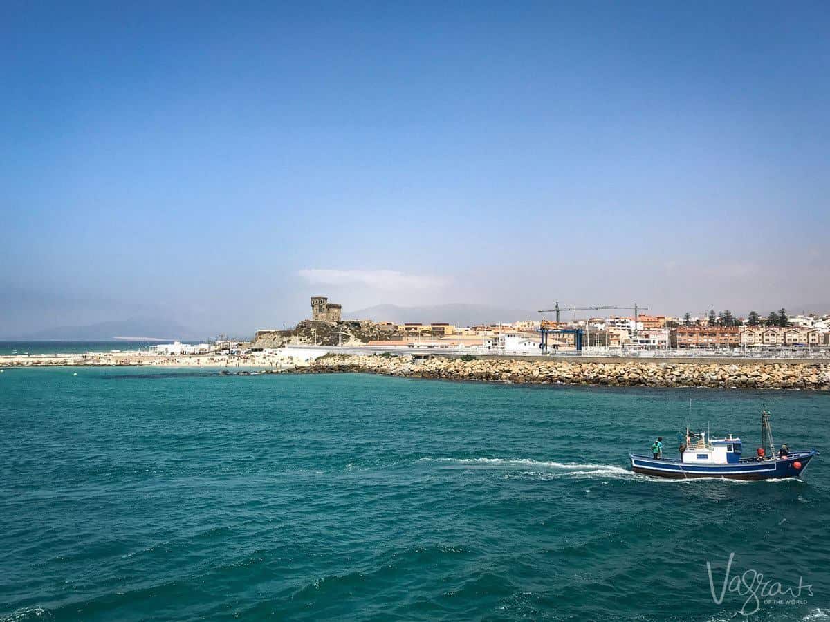 fishing boat coming into port in Tarifa. Looking for the Best Day trips from Seville. Try a day trip from Seville to Tarifa