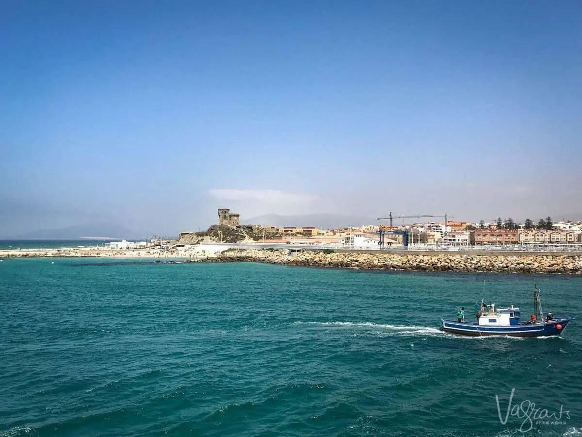 fishing boat coming into port in Tarifa. Looking for the Best Day trips from Seville. Try a day trip from Seville to Tarifa