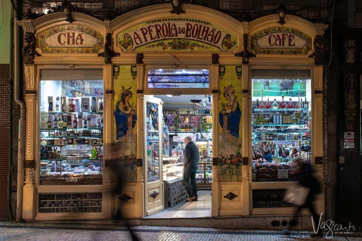 Beautiful painted Art Nouveau exterior of A Perola do Bolhao Deli in Porto.