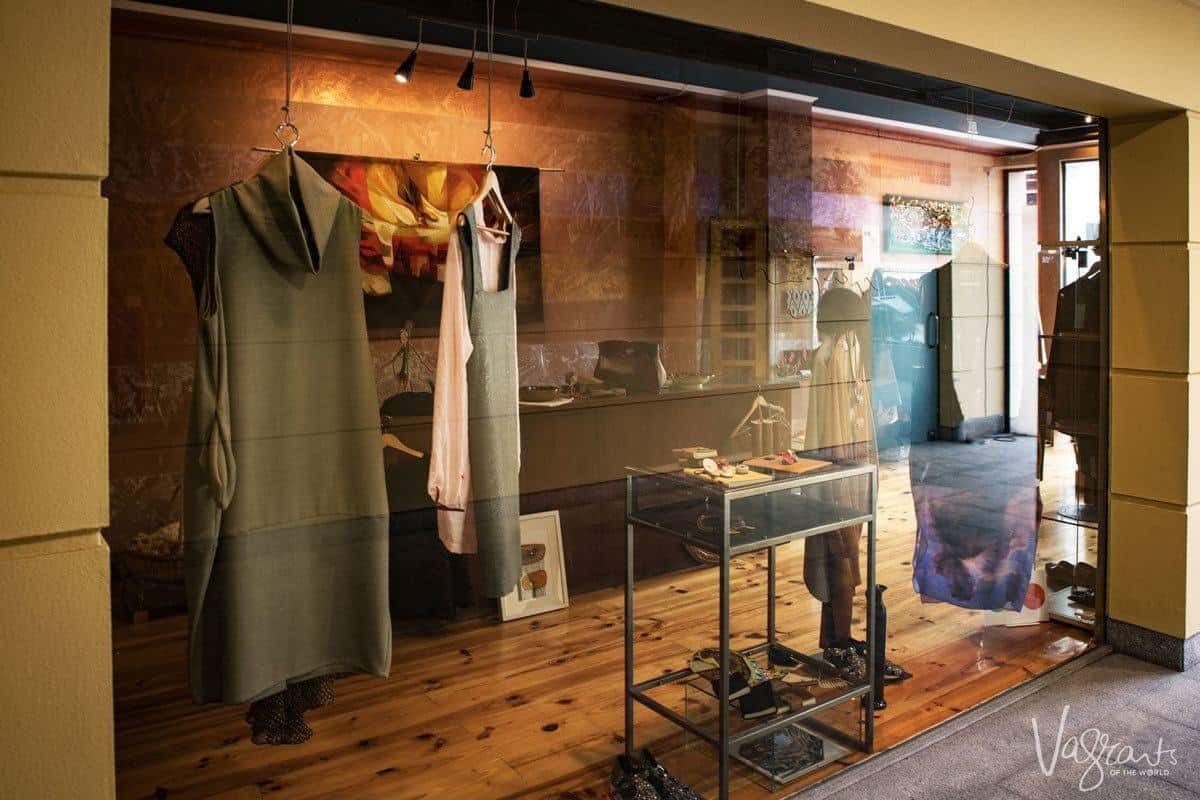 Women's dresses in a shop window Centro Comercial Bombarda in Porto.