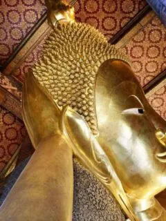 looking up at golden buddha head. angles are one of the best Travel Photography Tips for Getting the Best Landmark Shots