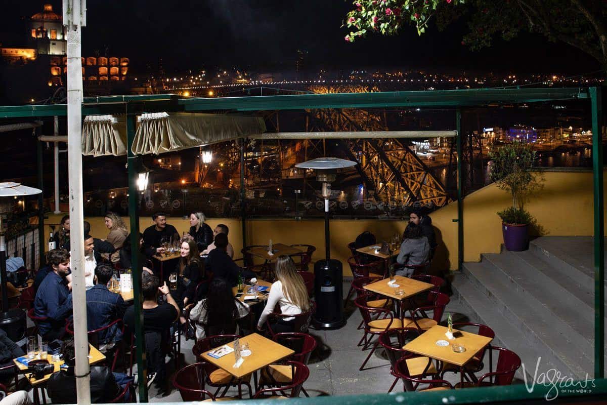 Groups of people drinking beer at Guindalense Football Club. 