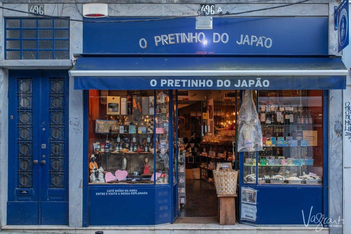 The blue shopfront of O Pretinho do Japao deli in Porto.