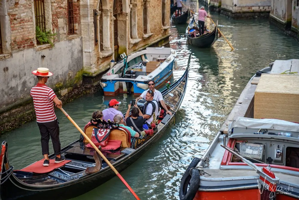 Travel safety - Tourists on a gondola ride in Venice