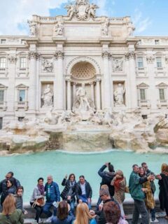 Guide to safe travel - Tourists crowded in front of the Trevi Fountain in Rome