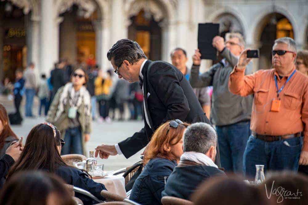 Tourists at a cafe in Italy - Safe Travel guide