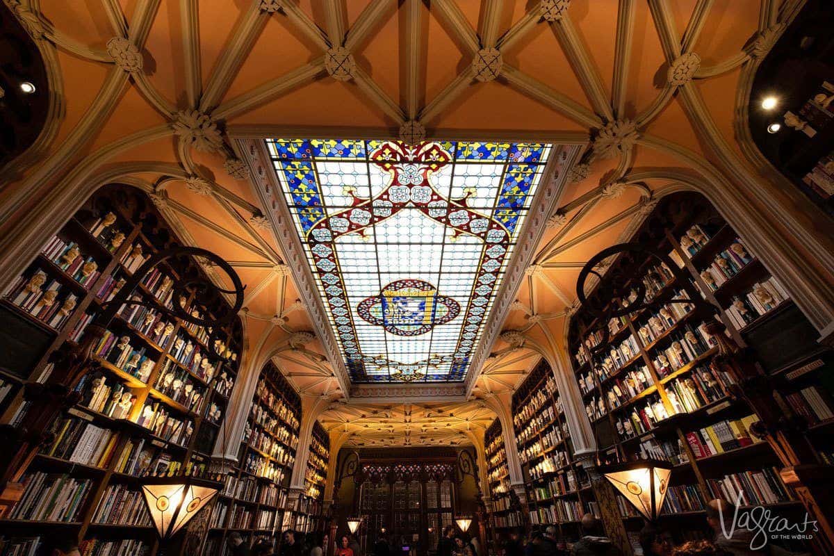 Patterned stained glass ceiling at Livraria Lello Bookshop.