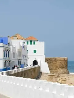 The white washed buildings overlooking the beach in Asilah Morocco.