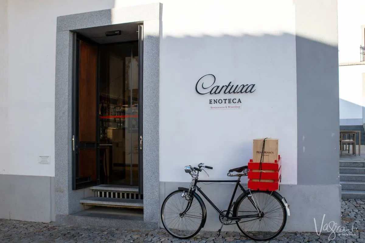 bicycle with wooden wine box carrier outside an alentejo wine store. drinking wine and enjoying fine alentejo food is what makes for the perfect alentejo portugal holiday 