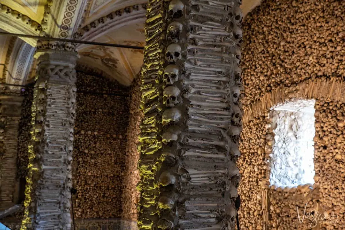 Walls and pillars made of human bones in the church of bones.  Stop here on your alentejo road trip as this rates as one of the best things to do in the alentejo portugal