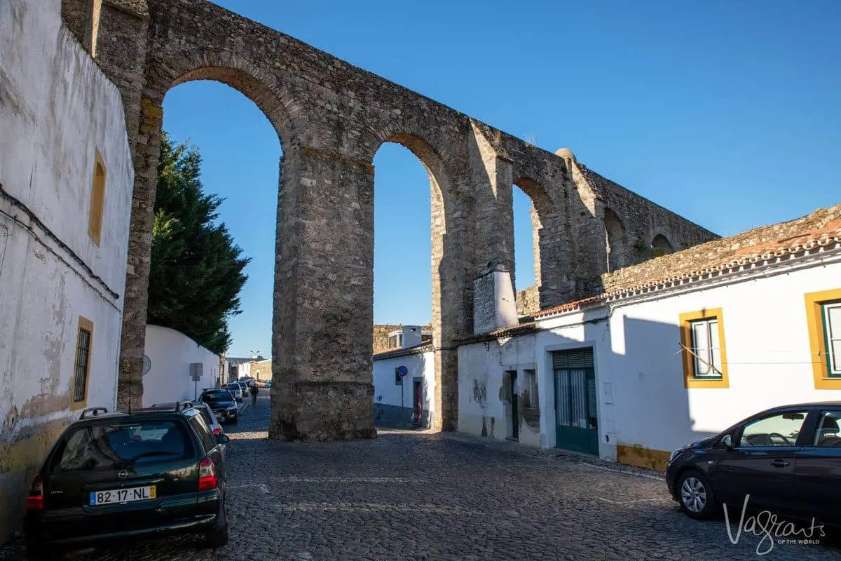 aqueduct running through and cutting off part of a cobble stone street.  there are some really unique and obscure things to see in the alentejo