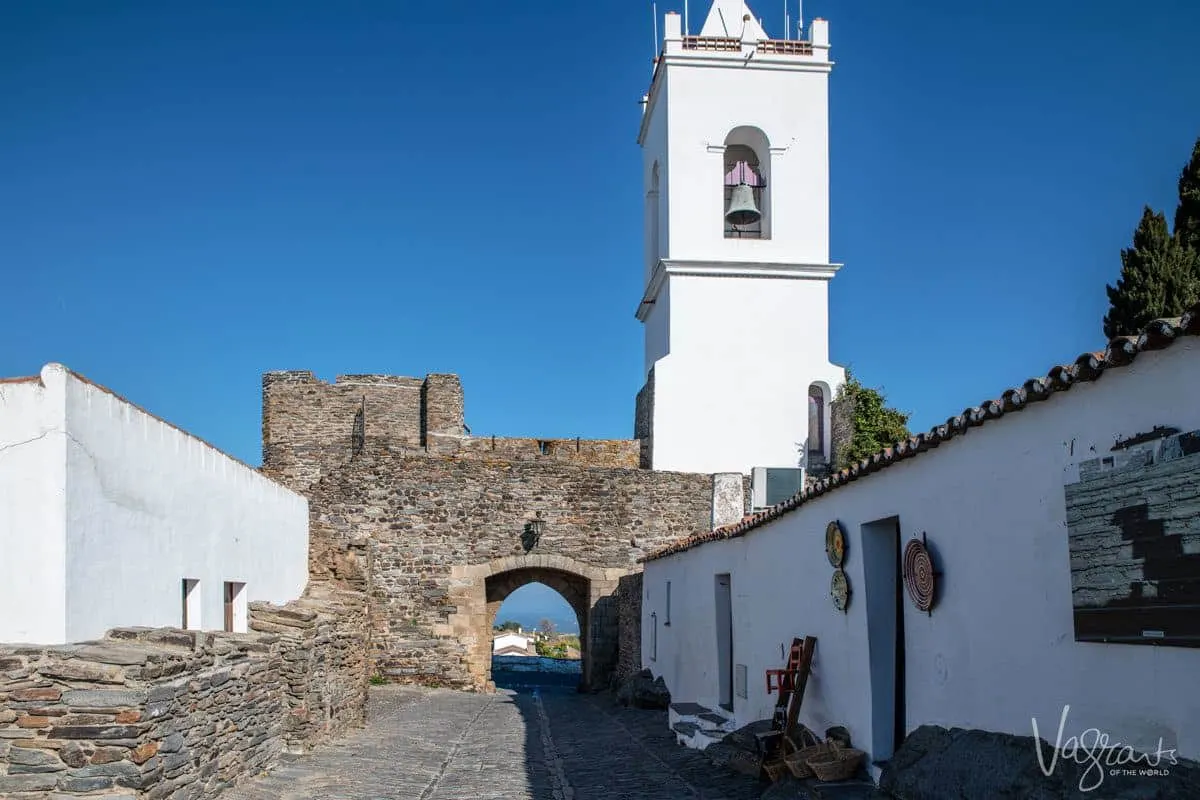 church tower and bell on top of castle wall in Monsaraz.  you can encorporate a visit to Monsaraz in day trips from evora or even lisbon.