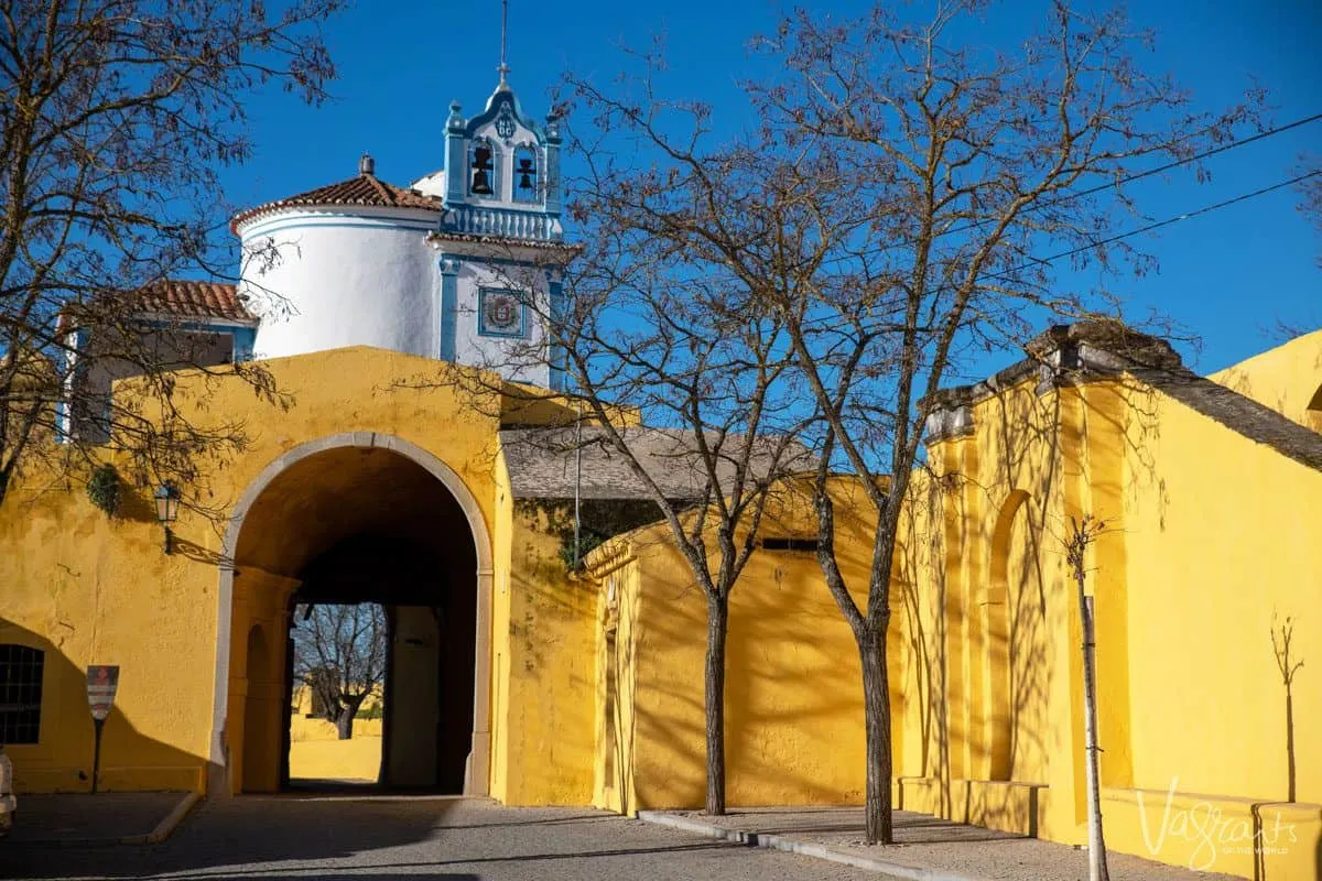 yellow walls and passage into ancient church.  These old buildings are alentejo highlights along with alentejo food and alentejo wine.  Alentejo portugal is also home to black pork a gastronomic highlight of any alentejo holiday