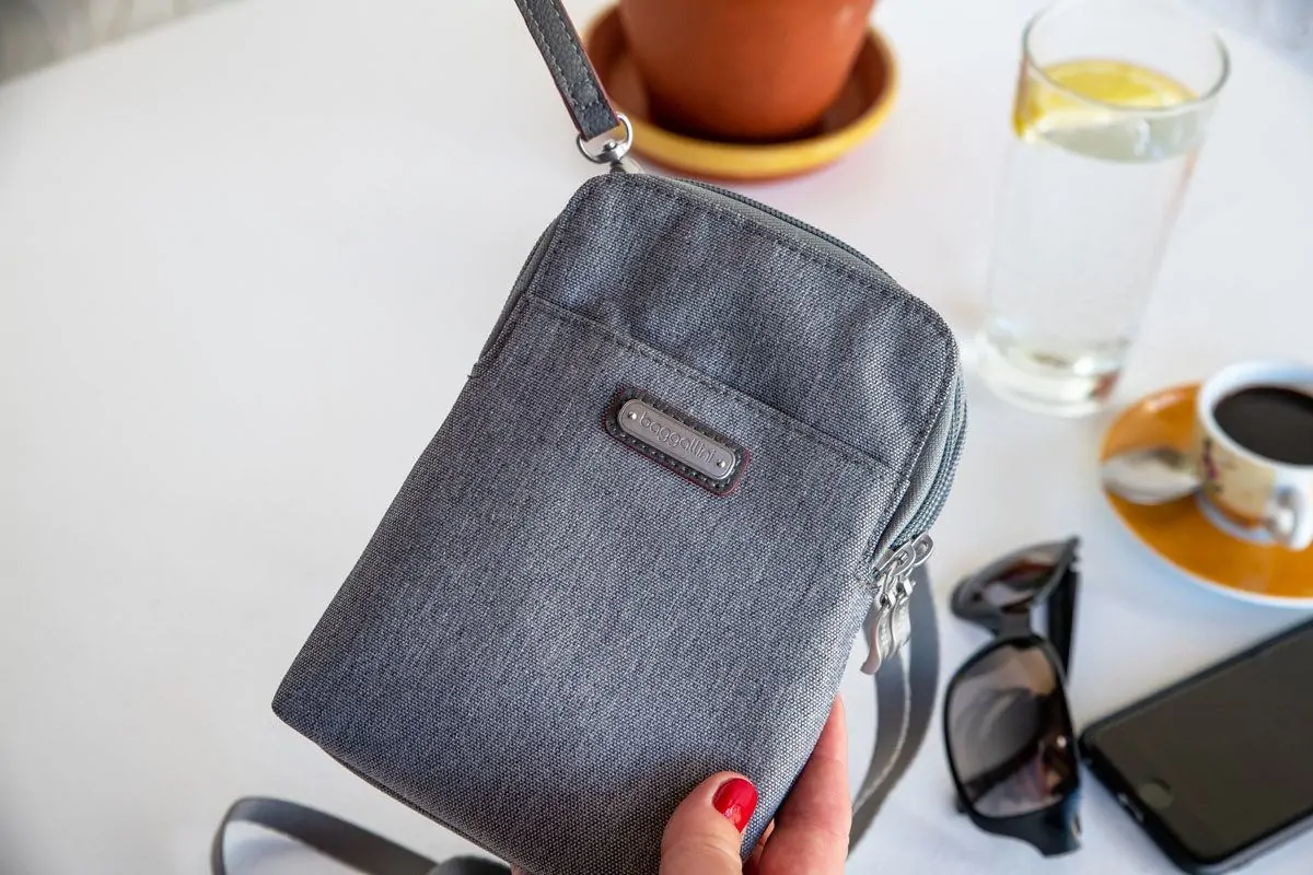 close up of a grey travel purse and this stylish design make it a perfect womens travel purse