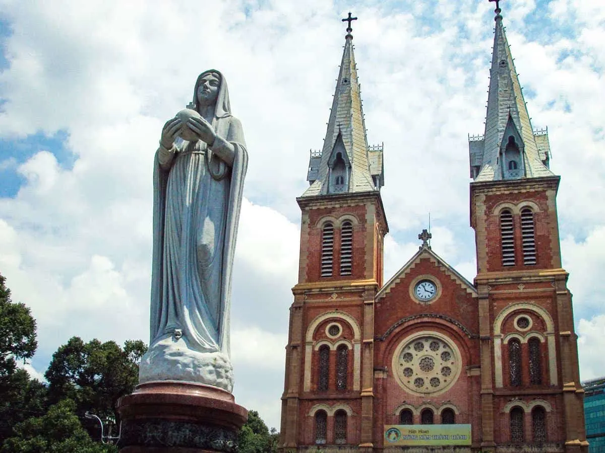A statue of Our Lady outside the romanesque styled cathedral. On of the best places to visit in Ho Chi Minh city