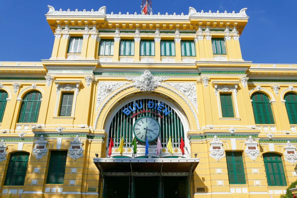Yellow and blue green facade of the Saigon central post office an unusual thing to do in Ho Chi Minh city is to visit the post office.
