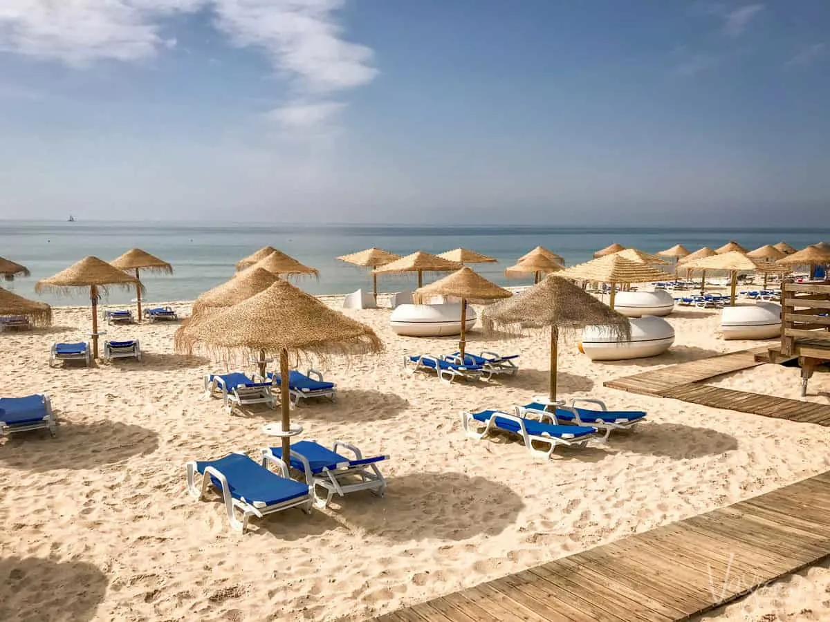 Beach beds and shades on a beach in Portugal. 