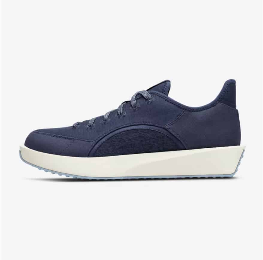 Product shot of a navy blue travel sneaker.