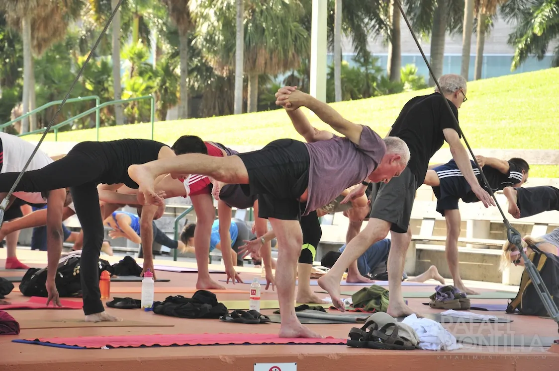 people doing Yoga in the park. There are loads of free you classes you can join throughout the week in Miami