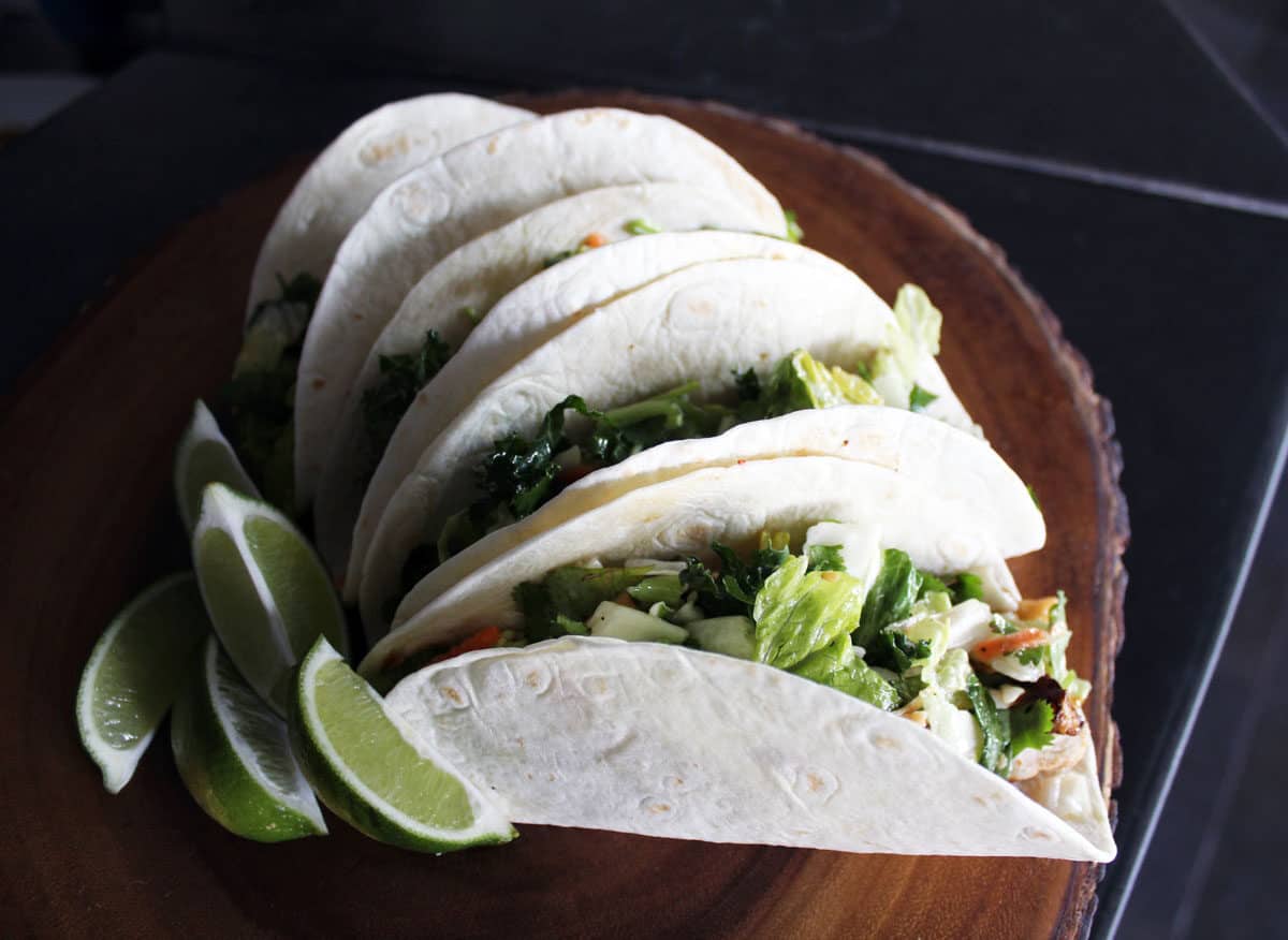 A plate of tacos and lime. One of the best free things to do in Miami is free taco Tuesday at Wood tavern