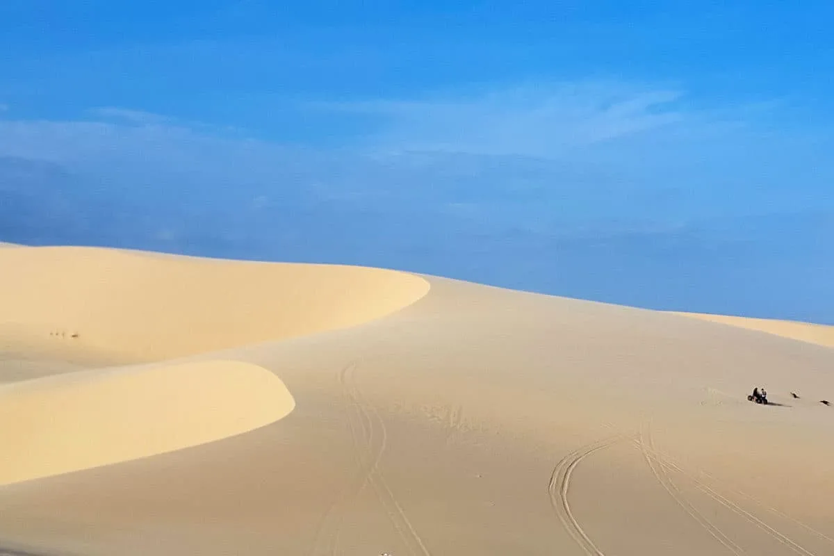 The white sand dunes of Mui ne against a blue sky. One of the most popular things to do in Mui Ne