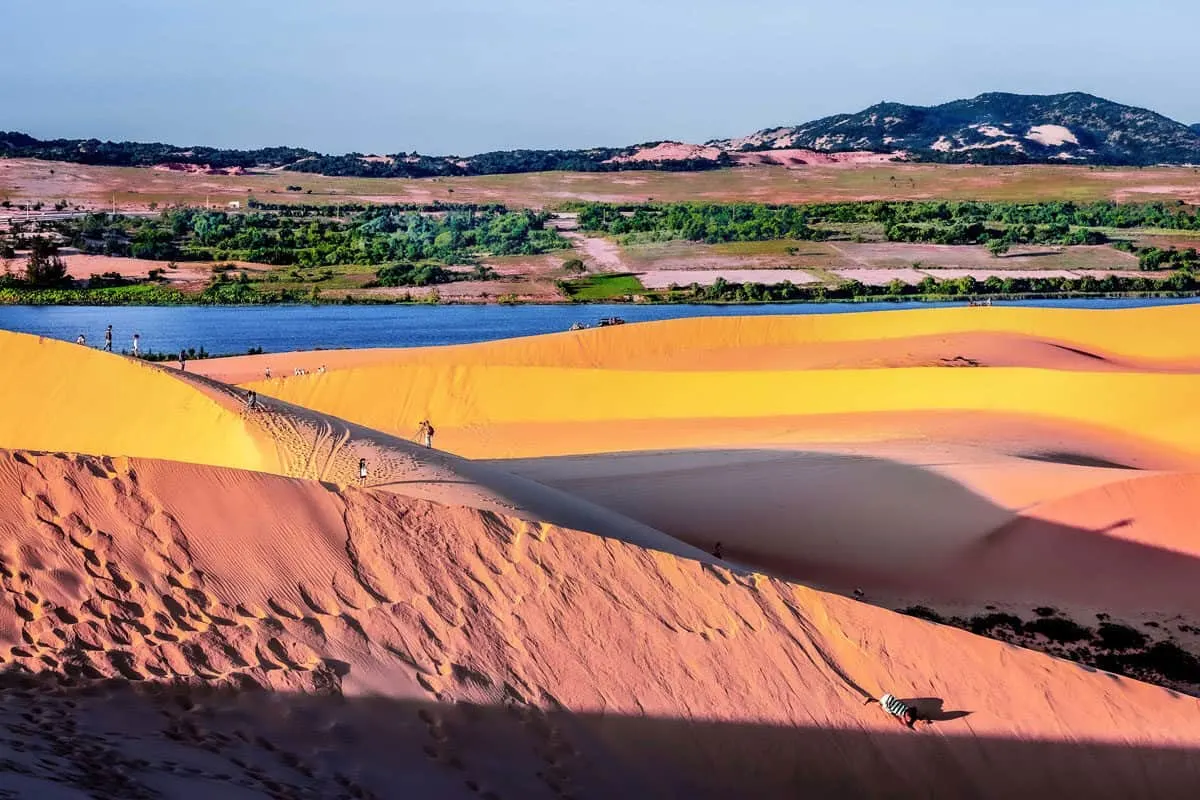 The red sand dunes of Mui Ne in Vietnam. Sandboarding on the dunes is one of the most popular things to do in Mui Ne