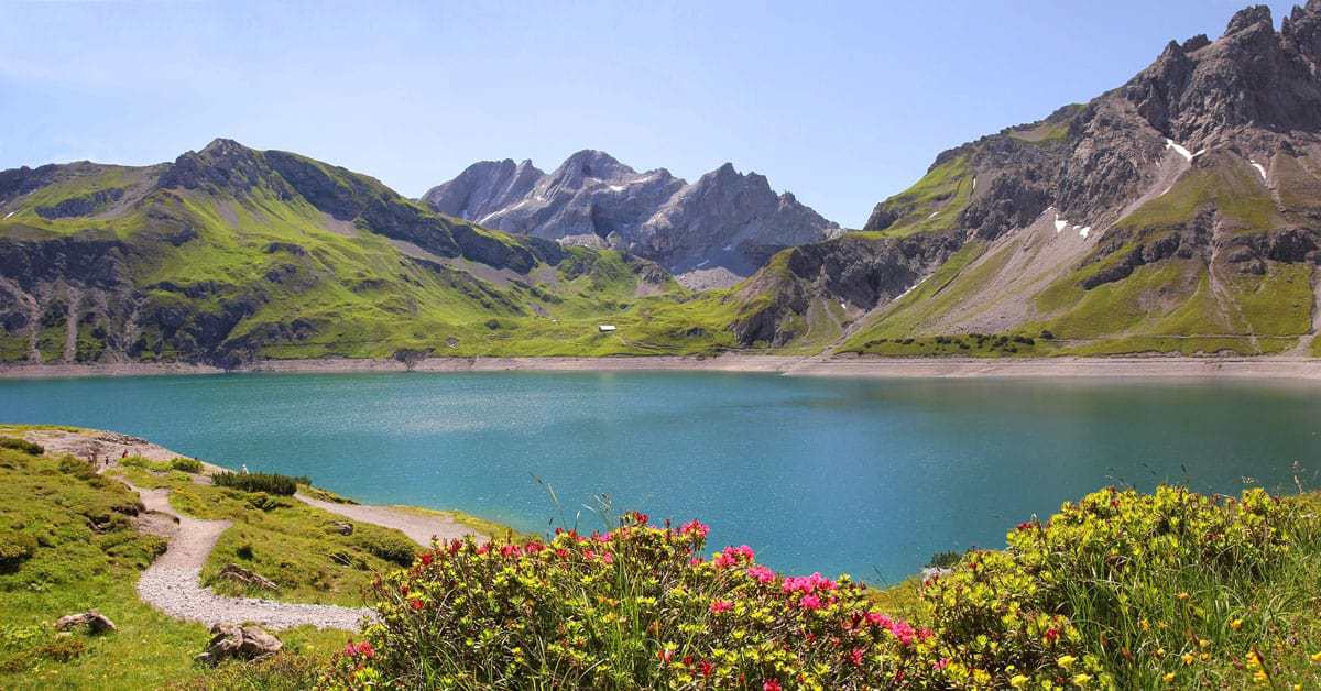 Arlberg Railway winds past lakes and mountains in Austria