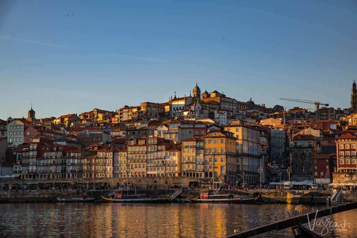Old town of Ribeira in Porto with the glow of the sun setting over the river