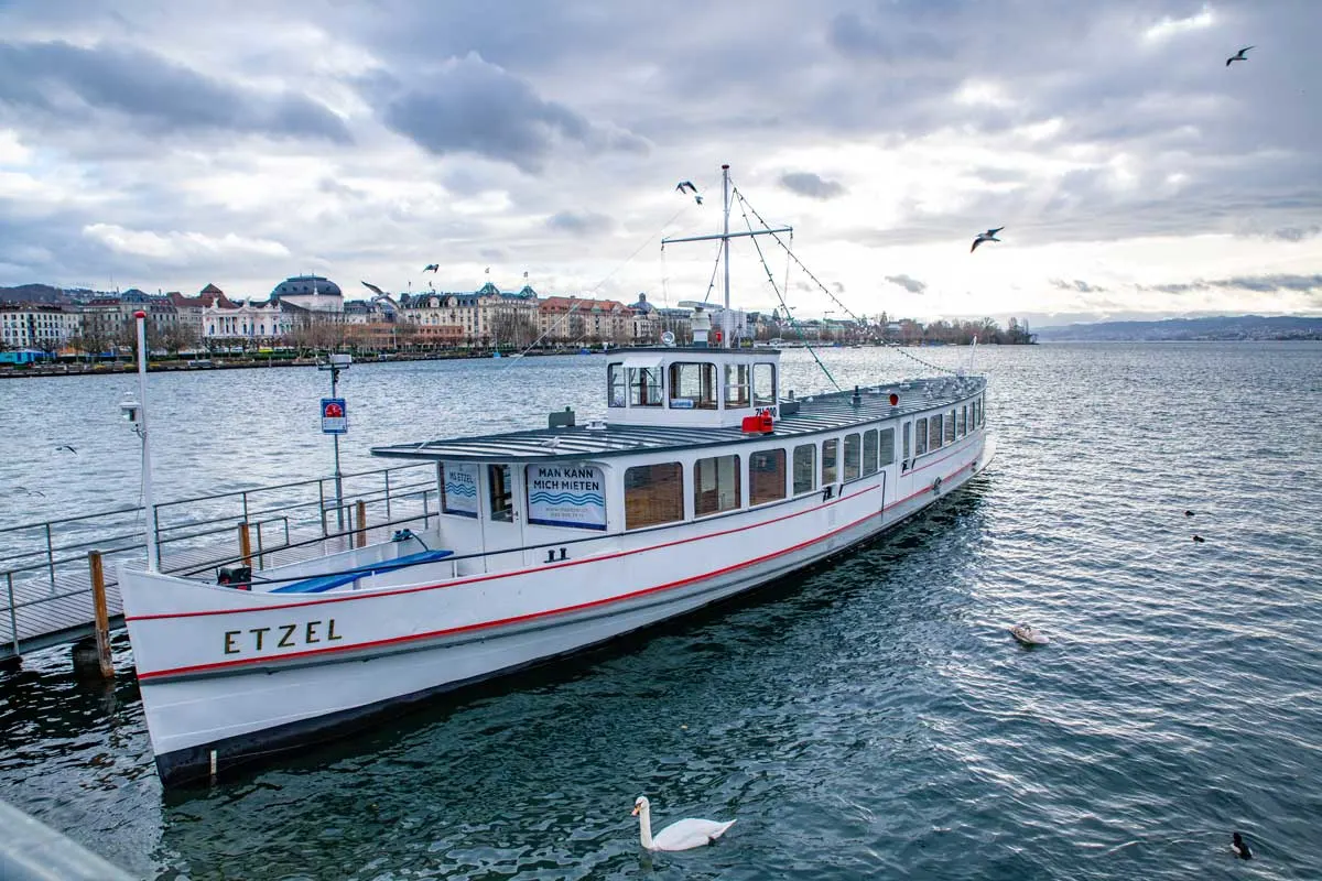 Old fashioned ferry boat on the shores of Lake Zurich, a lake cruise is a great way to spend your time. 