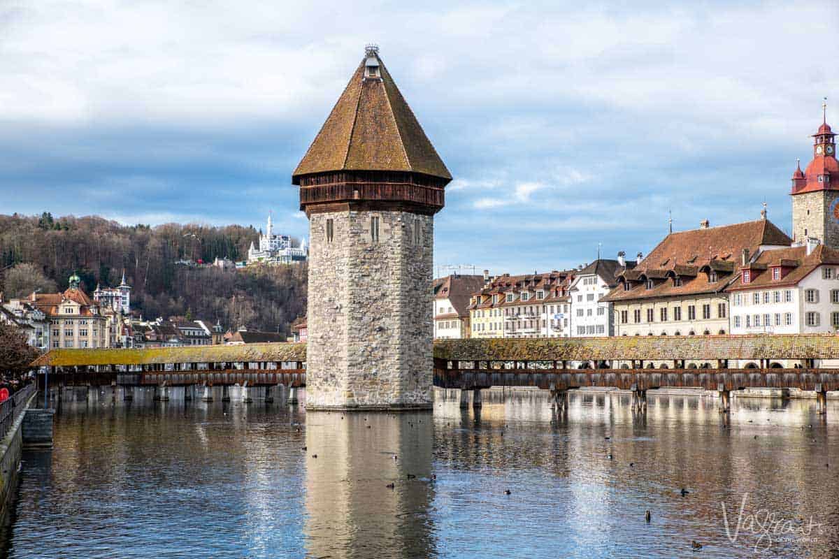 The Chapel Bridge and watchtower, popular attractions in Lucerne Switzerland. 