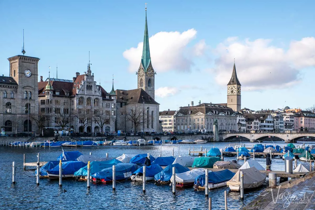 River boats moored and Zurich Old town with the church spires. 
